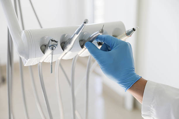 Professional Tooth Extraction technician working in Manila, AR
